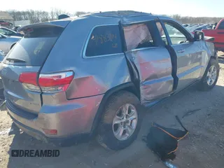 2014 Jeep Grand Cherokee Laredo with VIN 1C4RJFAG0EC289647, listed as a IAAI auction lot 41883914 with 176,501 mi miles and . Bid and sale history available at DreamBid. Image 4.