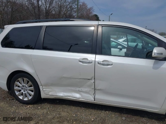 2015 Toyota Sienna XLE with VIN 5TDYK3DC0FS570007, listed as a IAAI auction lot 41794333 with 217,512 mi miles. Bid and sale history available at carsss.com. Image 6.
