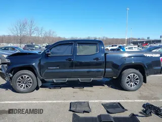2021 Toyota Tacoma 4WD SR5 with VIN 3TMDZ5BN4MM117564, listed as a IAAI auction lot 41629220 with 77,063 mi miles. Bid and sale history available at carsss.com. Image 15.