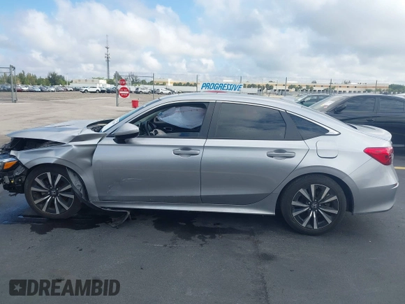 2023 Honda Civic EX z VIN 2HGFE1F79PH303727, wystawiony jako IAAI lot #42251695 z przebiegiem 21 071 mil mil oraz . Historia ofert i sprzedaży dostępna na DreamBid. Obrazek 14.