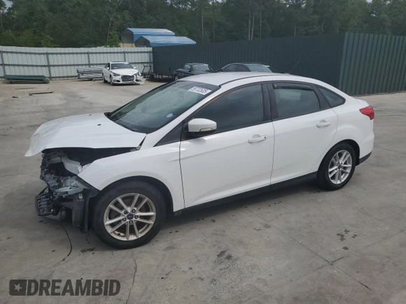 2015 Ford Focus SE with VIN 1FADP3F21FL246821, listed as a Copart auction lot 59732635 with 135,752 mi miles and Salvage title. Bid and sale history available at DreamBid. Image 1.