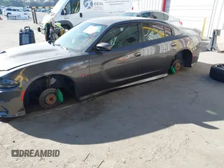 2019 Dodge Charger Scat Pack with VIN 2C3CDXGJ2KH564051, listed as a IAAI auction lot 41255283 with 64,687 mi miles and . Bid and sale history available at DreamBid. Image 17.