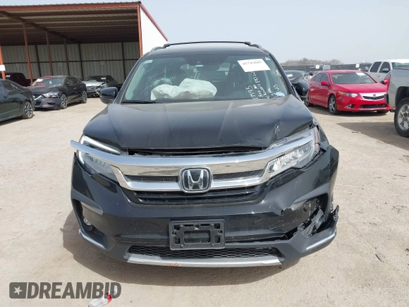 2020 Honda Pilot Touring 8-Passenger with VIN 5FNYF6H91LB003552, listed as a IAAI auction lot 41743685 with 76,725 mi miles and . Bid and sale history available at DreamBid. Image 12.
