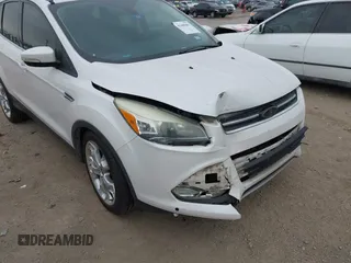2015 Ford Escape Titanium with VIN 1FMCU0J98FUC07537, listed as a IAAI auction lot 41440462 with 233,924 mi miles. Bid and sale history available at carsss.com. Image 6.