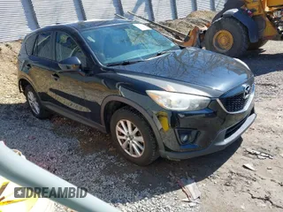2014 Mazda CX-5 Touring with VIN JM3KE4CY8E0333029, listed as a IAAI auction lot 41857199 with 218,887 mi miles. Bid and sale history available at carsss.com. Image 1.