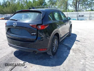 2018 Mazda CX-5 Sport with VIN JM3KFBBM4J0417018, listed as a IAAI auction lot 41984290 with 104,113 mi miles. Bid and sale history available at carsss.com. Image 4.