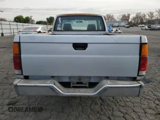 1988 Nissan Hardbody z VIN 1N6ND16S7JC395431, wystawiony jako Copart lot #86765244 z przebiegiem 99 134 mil mil oraz Tytuł czysty. Historia ofert i sprzedaży dostępna na DreamBid. Obrazek 6.
