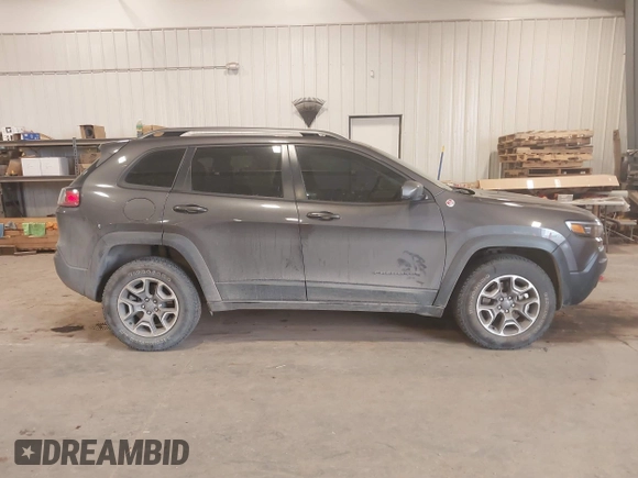 2020 Jeep Cherokee Trailhawk z VIN 1C4PJMBX8LD627104, wystawiony jako IAAI lot #41493732 z przebiegiem 46 463 mil mil oraz . Historia ofert i sprzedaży dostępna na DreamBid. Obrazek 13.