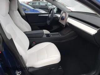 2023 Tesla Model Y Long Range with VIN 7SAYGDEE6PF947827, listed as a IAAI auction lot 41443524 with 12,381 mi miles and . Bid and sale history available at DreamBid. Image 5.