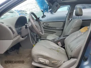 2000 Nissan Maxima GXE with VIN JN1CA31A1YT223132, listed as a Copart auction lot 60148655 with 269,258 mi miles and Salvage title. Bid and sale history available at DreamBid. Image 7.
