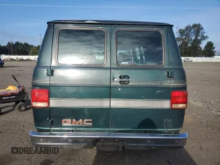 1991 GMC Vandura z VIN 1GDEG25K6M7504729, wystawiony jako Copart lot #71146614 z przebiegiem 181 800 mil mil oraz Tytuł czysty. Historia ofert i sprzedaży dostępna na DreamBid. Obrazek 6.