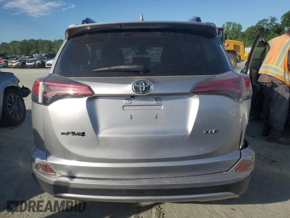 2018 Toyota RAV4 XLE with VIN JTMWFREV0JJ191707, listed as a Copart auction lot 57821575 with Not provided miles and Salvage title. Bid and sale history available at DreamBid. Image 6.