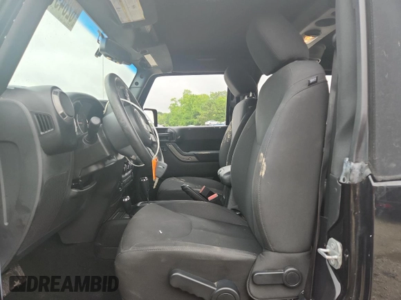 2016 Jeep Wrangler Willys Wheeler with VIN 1C4GJWAG6GL326498, listed as a Copart auction lot 62849715 with 49,414 mi miles and Salvage title. Bid and sale history available at DreamBid. Image 7.