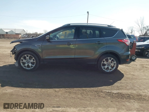 2016 Ford Escape Titanium with VIN 1FMCU9JX5GUA65412, listed as a IAAI auction lot 41859123 with 80,208 mi miles and . Bid and sale history available at DreamBid. Image 14.