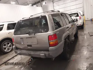 1998 Jeep Grand Cherokee Laredo with VIN 1J4GZ58S3WC343555, listed as a IAAI auction lot 41528943 with 219,146 mi miles. Bid and sale history available at carsss.com. Image 17.