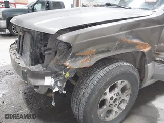 1999 Jeep Grand Cherokee Laredo with VIN 1J4GW58SXXC584734, listed as a IAAI auction lot 41902224 with 209,180 mi miles. Bid and sale history available at carsss.com. Image 6.