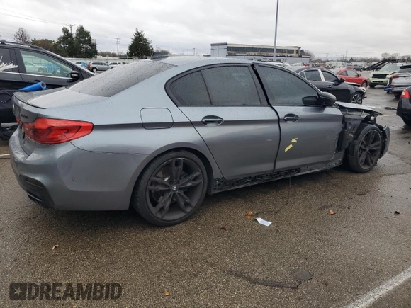 2018 BMW 5 Series M550i xDrive with VIN WBAJB9C54JB286707, listed as a Copart auction lot 49158435 with 74,307 mi miles and Salvage title. Bid and sale history available at DreamBid. Image 3.