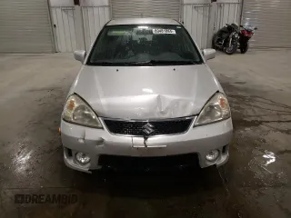 2005 Suzuki Aerio SX z VIN JS2RC61H555300879, wystawiony jako Copart lot #80481084 z przebiegiem 129 196 mil mil oraz Szkody całkowita. Historia ofert i sprzedaży dostępna na DreamBid. Obrazek 5.