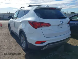 2017 Hyundai Santa Fe 2.4L z VIN 5XYZU3LB7HG438756, wystawiony jako IAAI lot #41480791 z przebiegiem 138 392 mil mil oraz . Historia ofert i sprzedaży dostępna na DreamBid. Obrazek 3.