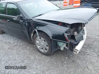 2002 Cadillac DeVille DTS z VIN 1G6KF579320288667, wystawiony jako IAAI lot #42331236 z przebiegiem 71 189 mil mil oraz . Historia ofert i sprzedaży dostępna na DreamBid. Obrazek 18.