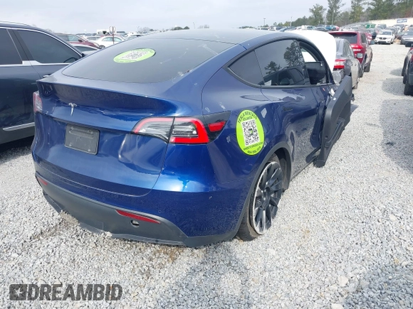 2021 Tesla Model Y Standard Range with VIN 5YJYGDED8MF122985, listed as a IAAI auction lot 41430423 with 120,302 mi miles and . Bid and sale history available at carsss.com. Image 4.