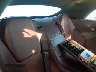 2006 Aston Martin DB9 z VIN SCFAB02A96GB04608, wystawiony jako Copart lot #76550654 z przebiegiem Nie podano mil oraz Nie do naprawy. Historia ofert i sprzedaży dostępna na DreamBid. Obrazek 10.