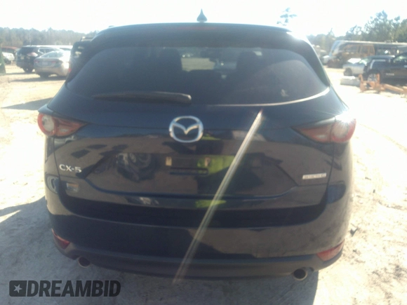 2020 Mazda CX-5 Touring with VIN JM3KFACM1L1817303, listed as a IAAI auction lot 41627859 with 57,268 mi miles. Bid and sale history available at carsss.com. Image 16.