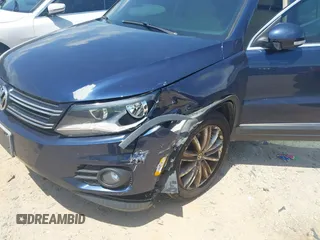 2012 Volkswagen Tiguan SE with VIN WVGAV7AX7CW534703, listed as a IAAI auction lot 42463358 with 119,699 mi miles and . Bid and sale history available at DreamBid. Image 6.