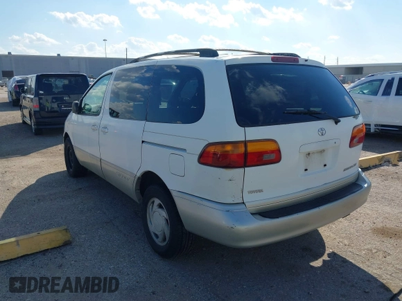 1999 Toyota Sienna LE with VIN 4T3ZF13C1XU152733, listed as a IAAI auction lot 40819395 with 184,540 mi miles. Bid and sale history available at carsss.com. Image 3.
