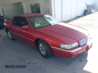 1997 Cadillac Eldorado Touring ETC z VIN 1G6ET1293VU601680, wystawiony jako IAAI lot #42469708 z przebiegiem 78 126 mil mil oraz . Historia ofert i sprzedaży dostępna na DreamBid. Obrazek 1.