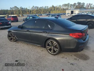 2019 BMW 5 Series M550i xDrive with VIN WBAJB9C57KB288906, listed as a Copart auction lot 79846274 with 61,744 mi miles and Salvage title. Bid and sale history available at DreamBid. Image 2.