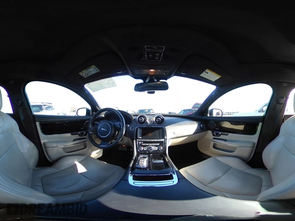 2015 Jaguar XJ with VIN SAJWA1CZ2F8V84677, listed as a IAAI auction lot 41723372 with 52,888 mi miles. Bid and sale history available at carsss.com. Image 18.