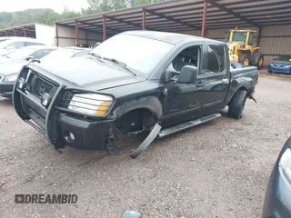 2007 Nissan Titan SE with VIN 1N6BA07A17N212890, listed as a IAAI auction lot 41034412 with 211,881 mi miles and . Bid and sale history available at DreamBid. Image 2.