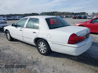 2005 Mercury Grand Marquis LS Premium z VIN 2MEFM75W05X621461, wystawiony jako IAAI lot #41381365 z przebiegiem 139 971 mil mil oraz . Historia ofert i sprzedaży dostępna na DreamBid. Obrazek 3.