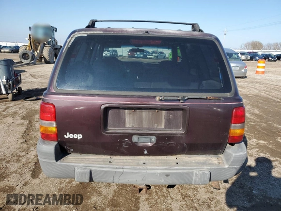 1997 Jeep Grand Cherokee Laredo with VIN 1J4GZ58S9VC687969, listed as a Copart auction lot 79930814 with 0 mi miles and Salvage Title. Bid and sale history available at carsss.com. Image 6.