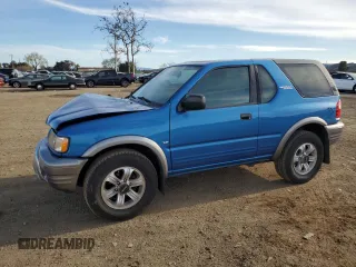 2001 Isuzu Rodeo z VIN 4S2CK57WX14319029, wystawiony jako Copart lot #47893745 z przebiegiem 66 840 mil mil oraz Szkoda całkowita • Salvage title. Historia ofert i sprzedaży dostępna na DreamBid. Obrazek 1.
