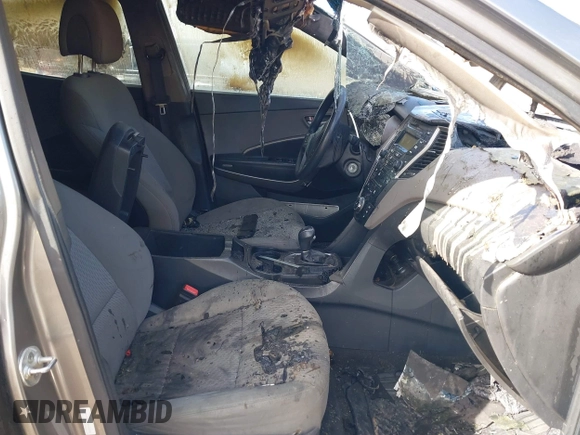 2016 Hyundai Santa Fe z VIN 5XYZTDLB7GG326076, wystawiony jako IAAI lot #41435551 z przebiegiem Nie podano mil oraz . Historia ofert i sprzedaży dostępna na DreamBid. Obrazek 5.