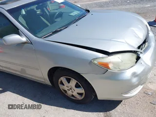 2004 Toyota Camry LE with VIN 4T1BE30K14U290983, listed as a IAAI auction lot 41983078 with 174,852 mi miles and . Bid and sale history available at carsss.com. Image 18.