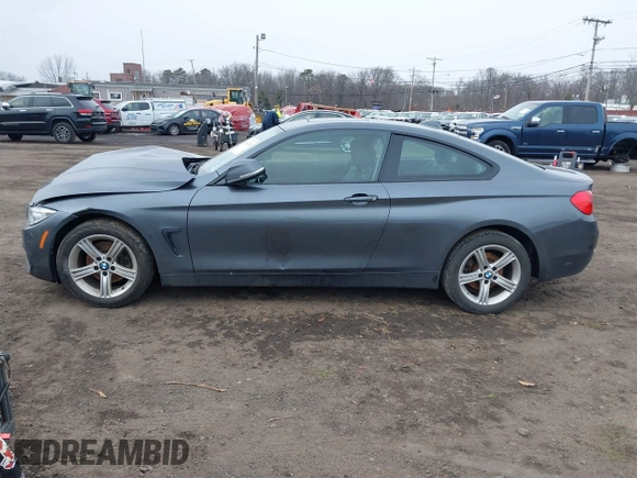 2014 BMW 4 Series 428i xDrive with VIN WBA3N9C50EK246002, listed as a IAAI auction lot 41612256 with 100,915 mi miles and . Bid and sale history available at carsss.com. Image 14.