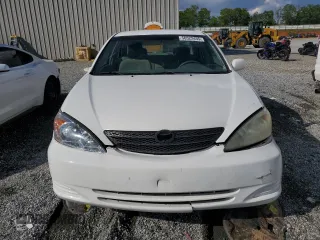 2002 Toyota Camry LE z VIN 4T1BE32K12U055722, wystawiony jako Copart lot #56522495 z przebiegiem 256 565 mil mil oraz Szkoda całkowita • Salvage title. Historia ofert i sprzedaży dostępna na DreamBid. Obrazek 5.