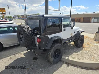 1993 Jeep Wrangler S z VIN 1J4FY19P5PP261872, wystawiony jako Copart lot #58435955 z przebiegiem 127 959 mil mil oraz Czysty tytuł • Clean title. Historia ofert i sprzedaży dostępna na DreamBid. Obrazek 4.