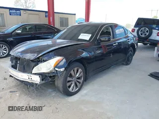 2012 Infiniti M with VIN JN1BY1AP1CM335867, listed as a IAAI auction lot 42169743 with 148,650 mi miles and . Bid and sale history available at DreamBid. Image 2.