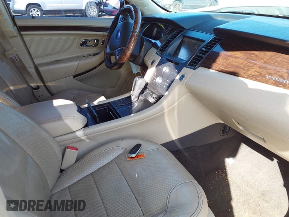 2014 Ford Taurus Limited with VIN 1FAHP2F89EG155934, listed as a IAAI auction lot 41760703 with 130,280 mi miles. Bid and sale history available at carsss.com. Image 5.