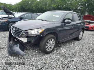2016 Mazda CX-5 Touring z VIN JM3KE4CY9G0835955, wystawiony jako Copart lot #61098145 z przebiegiem 52 691 mil mil oraz Czysty tytuł • Clean title. Historia ofert i sprzedaży dostępna na DreamBid. Obrazek 1.