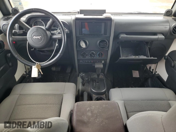 2008 Jeep Wrangler Rubicon z VIN 1J8GA69198L614736, wystawiony jako Copart lot #50826545 z przebiegiem 124 801 mil mil oraz Czysty tytuł • Clean title. Historia ofert i sprzedaży dostępna na DreamBid. Obrazek 8.