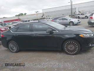 2016 Ford Fusion Titanium with VIN 3FA6P0K97GR118922, listed as a IAAI auction lot 42121212 with 256,584 mi miles and . Bid and sale history available at DreamBid. Image 13.
