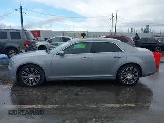 2013 Chrysler 300 with VIN 2C3CCABG3DH736120, listed as a IAAI auction lot 41765794 with 126,268 mi miles. Bid and sale history available at carsss.com. Image 14.