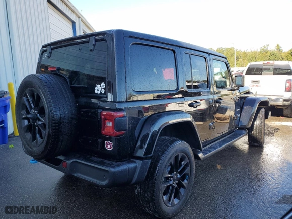 2022 Jeep Wrangler 4xe Unlimited Sahara with VIN 1C4JJXP61NW277801, listed as a Copart auction lot 48733695 with 26,621 mi miles and Salvage Title. Bid and sale history available at carsss.com. Image 3.