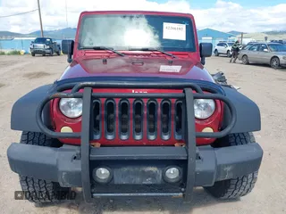 2012 Jeep Wrangler Unlimited Sport z VIN 1C4BJWDG8CL258625, wystawiony jako IAAI lot #42266102 z przebiegiem 58 594 mil mil oraz . Historia ofert i sprzedaży dostępna na DreamBid. Obrazek 13.