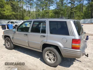 1998 Jeep Grand Cherokee Limited with VIN 1J4GZ78YXWC160346, listed as a Copart auction lot 52595655 with Not provided miles and Salvage title. Bid and sale history available at DreamBid. Image 2.